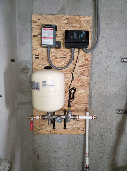 Water well pump system in garage